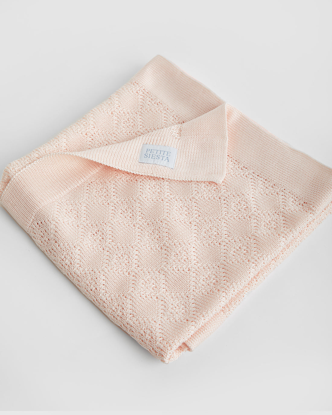 Couverture en coton perlé rose 