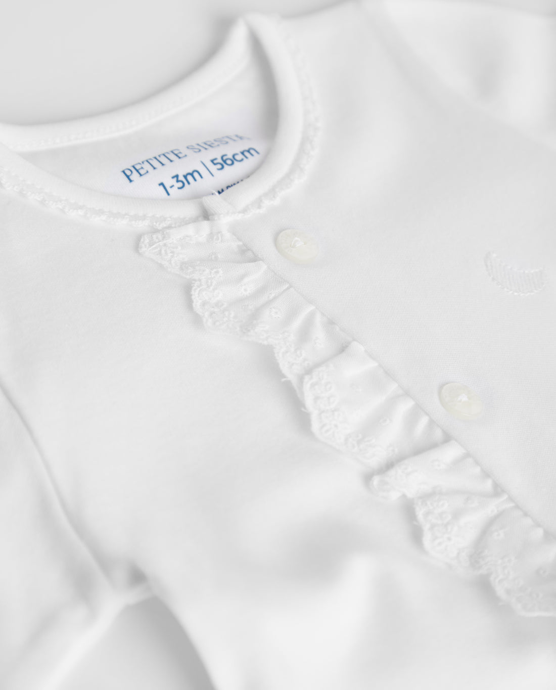 Pyjama bébé à rayures blanches brodées
